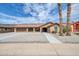 Tan house with solar panels, double garage, and walkway at 18822 N Grandview Dr, Sun City West, AZ 85375