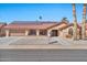 Single-story home with solar panels and landscaped yard at 18822 N Grandview Dr, Sun City West, AZ 85375