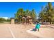 Community playground with play structures for children at 961 E Blue Spruce Ln, Gilbert, AZ 85298