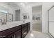 A bathroom with a double vanity sink, a large mirror, and a glass shower at 4505 S Mole --, Mesa, AZ 85212