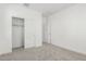 Bedroom showcasing carpet, a closet with sliding doors, and a crisp, neutral color palette at 4505 S Mole --, Mesa, AZ 85212