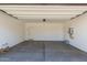 Spacious two-car garage with concrete floor, insulated door, water heater, and ample room for storage at 4505 S Mole --, Mesa, AZ 85212