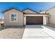This home has a two car garage and desert landscaping at 4505 S Mole --, Mesa, AZ 85212