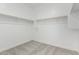 Spacious walk-in closet with wood racks and shelving provides ample storage space for any wardrobe at 4505 S Mole --, Mesa, AZ 85212