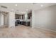 Modern kitchen featuring stainless steel appliances and dark wood cabinets at 1291 W Treasure Trl, Apache Junction, AZ 85120