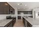 Modern kitchen with granite countertops and dark brown cabinets at 1449 W Saddle Run, Apache Junction, AZ 85120