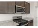 Stainless steel appliances and granite countertops in the kitchen at 1449 W Saddle Run, Apache Junction, AZ 85120