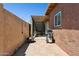 Private backyard featuring a tile patio, grill, shade structure and desert landscaping at 15601 N 27Th St # 7, Phoenix, AZ 85032