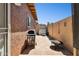 Private backyard featuring a tile patio, grill, storage shed and desert landscaping at 15601 N 27Th St # 7, Phoenix, AZ 85032