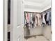Walk-in closet with ample hanging space and built-in shelving for organized storage at 15601 N 27Th St # 7, Phoenix, AZ 85032