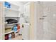 Laundry room with washer, dryer, and shelving stocked with laundry supplies at 15601 N 27Th St # 7, Phoenix, AZ 85032