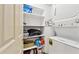 Laundry room featuring washer, dryer, and shelving with storage for laundry supplies at 15601 N 27Th St # 7, Phoenix, AZ 85032