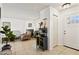Living room with a tiled floor, fireplace, decorative furnishings, and an entry door at 15601 N 27Th St # 7, Phoenix, AZ 85032