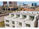 Aerial view of townhomes showcasing rooftop decks and city views at 312 E Windsor Ave # 11, Phoenix, AZ 85004