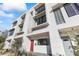 Modern townhome exterior with red door and clean lines at 312 E Windsor Ave # 11, Phoenix, AZ 85004