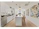 Modern white kitchen with island seating and open floor plan at 312 E Windsor Ave # 11, Phoenix, AZ 85004