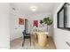 Bright home office with wood desk, black chairs, and light wood floors at 312 E Windsor Ave # 11, Phoenix, AZ 85004