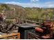 Relaxing backyard patio with fire pit and seating, offering mountain views at 41313 N Rolling Green Way, Anthem, AZ 85086