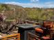 Relaxing backyard patio with fire pit and seating, offering mountain views at 41313 N Rolling Green Way, Anthem, AZ 85086