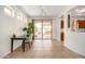 Bright dining area featuring a sliding glass door to the backyard and access to the kitchen at 41313 N Rolling Green Way, Anthem, AZ 85086