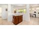 Kitchen view featuring an island with storage, and an open view to the living room at 41313 N Rolling Green Way, Anthem, AZ 85086