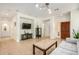 Spacious living room boasting tile flooring, recessed lighting, and contemporary fixtures at 41313 N Rolling Green Way, Anthem, AZ 85086