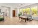 Open living room featuring tile flooring and a view of the entryway and green backyard at 41313 N Rolling Green Way, Anthem, AZ 85086