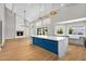 Bright and open living space with a fireplace, kitchen island, and high ceilings at 12222 N 74Th St, Scottsdale, AZ 85260