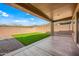 Covered patio overlooking a grassy backyard with artificial turf at 41432 N Bent Creek Way, Phoenix, AZ 85086