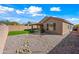 Backyard with gravel, artificial turf, and rock features at 41432 N Bent Creek Way, Phoenix, AZ 85086