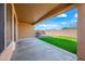 Covered patio with a view of the artificial turf backyard at 41432 N Bent Creek Way, Phoenix, AZ 85086