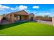 Artificial turf backyard with covered patio at 41432 N Bent Creek Way, Phoenix, AZ 85086