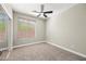 Well-lit bedroom featuring carpet flooring and ceiling fan at 41432 N Bent Creek Way, Phoenix, AZ 85086