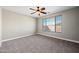 Spacious bedroom with neutral carpet and ceiling fan at 41432 N Bent Creek Way, Phoenix, AZ 85086