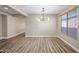 Dining room with hardwood floors and modern chandelier at 41432 N Bent Creek Way, Phoenix, AZ 85086