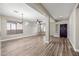 Bright dining room with hardwood floors, chandelier, and entryway at 41432 N Bent Creek Way, Phoenix, AZ 85086