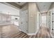 Bright hallway with wood-look floors offering views into the kitchen at 41432 N Bent Creek Way, Phoenix, AZ 85086