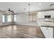 Bright kitchen features white cabinets, marble countertops, and modern appliances at 41432 N Bent Creek Way, Phoenix, AZ 85086