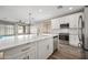 Open concept kitchen with island and living room view at 41432 N Bent Creek Way, Phoenix, AZ 85086