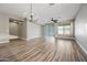 Spacious living room with wood-look floors and ceiling fan at 41432 N Bent Creek Way, Phoenix, AZ 85086