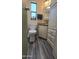 Functional bathroom featuring a toilet, vanity, and storage cabinet at 17200 W Bell Rd # 569, Surprise, AZ 85374