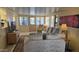 Bright living room featuring neutral tones, a plush sofa, and ample natural light at 17200 W Bell Rd # 569, Surprise, AZ 85374