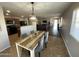 Bright dining area with a farmhouse table and kitchen views at 1244 E Desert Rose Trl, San Tan Valley, AZ 85143