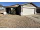 House exterior featuring a gray color scheme and a two-car garage at 1244 E Desert Rose Trl, San Tan Valley, AZ 85143