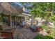 Beautiful backyard patio with stone flooring, comfortable seating, and a shaded pergola for outdoor relaxation at 8101 N Central Ave # 6, Phoenix, AZ 85020