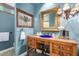 Charming bathroom with a unique vanity, stained glass window and distinctive lighting fixtures at 8101 N Central Ave # 6, Phoenix, AZ 85020