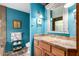 Unique bathroom design with rustic vanity, decorative mirror, and distinctive blue wall color at 8101 N Central Ave # 6, Phoenix, AZ 85020
