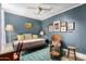 Cozy bedroom featuring a daybed, eclectic decor, and a mix of vintage and modern furnishings at 8101 N Central Ave # 6, Phoenix, AZ 85020