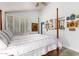 Airy bedroom features a four poster bed, shuttered windows, and stylish decor at 8101 N Central Ave # 6, Phoenix, AZ 85020