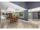 Open concept dining area features wood floors and a large window showcasing the outdoors at 8101 N Central Ave # 6, Phoenix, AZ 85020